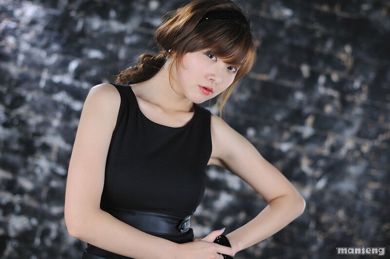woman in black top posing