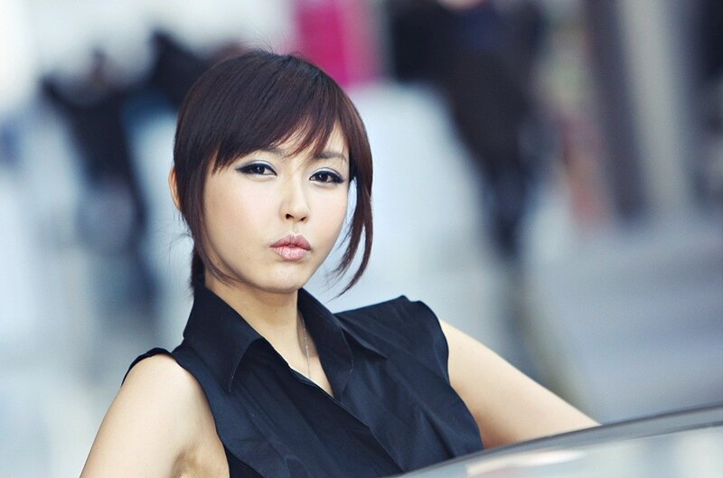 woman in black top posing