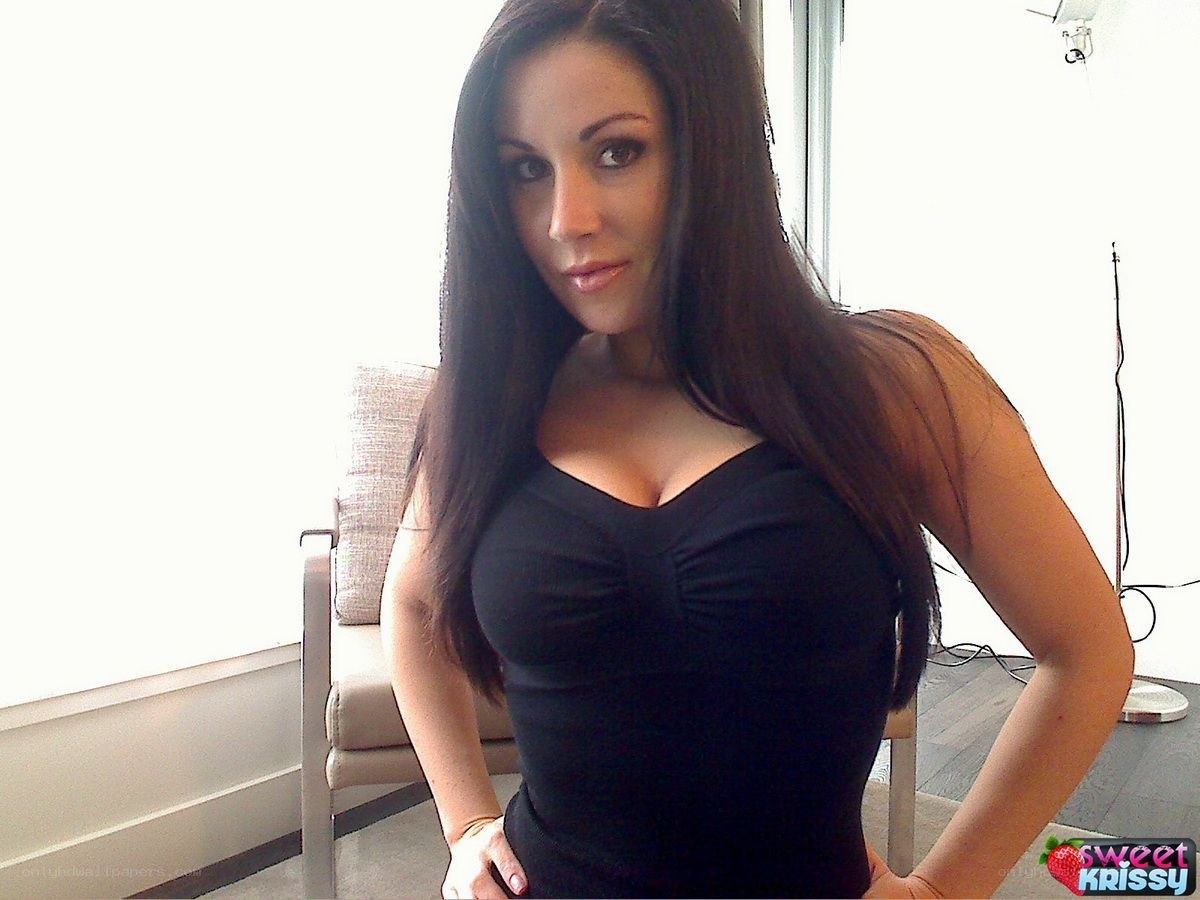 woman in black top posing