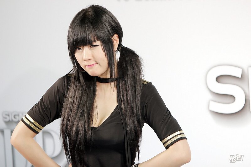 woman in black top posing
