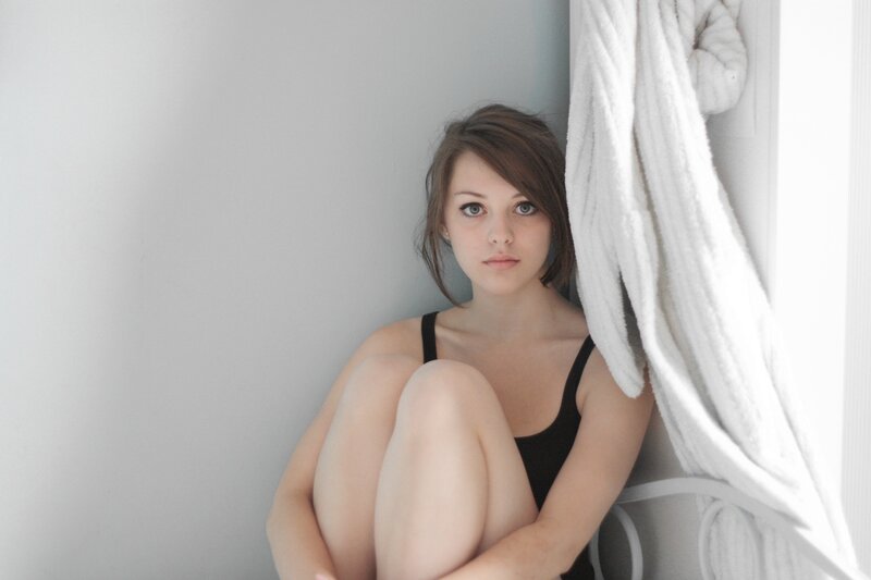 woman in black top sitting
