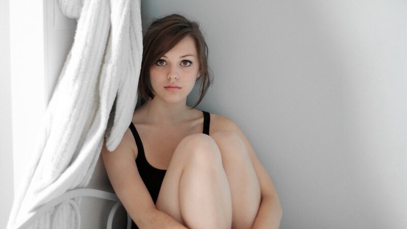 woman in black top sitting