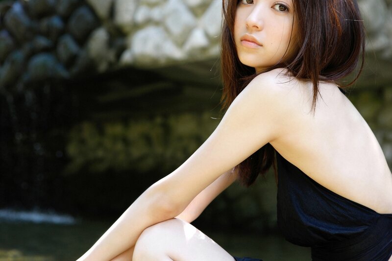 woman in black top sitting