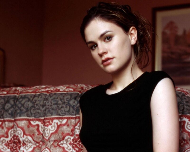 woman in black top sitting