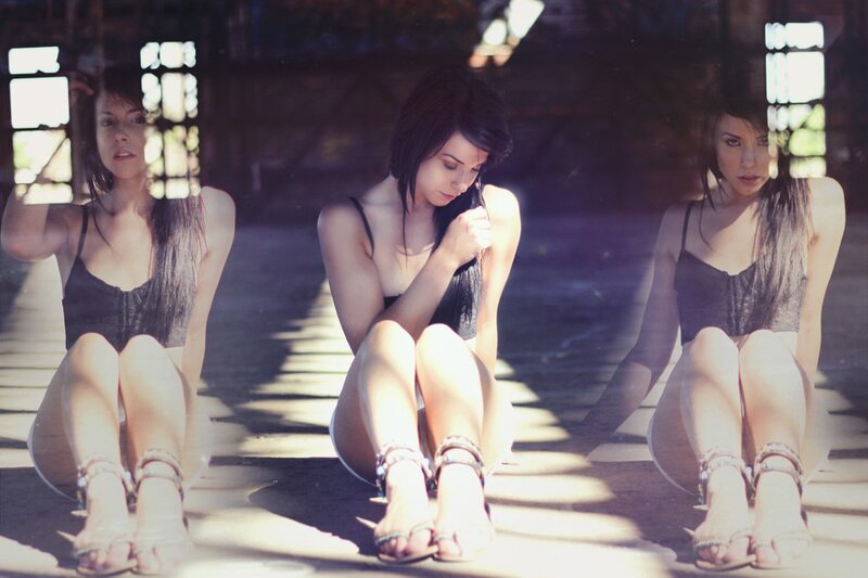 woman in black top sitting on floor
