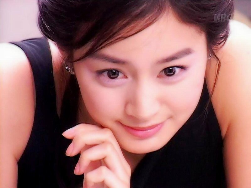 woman in black top smiling