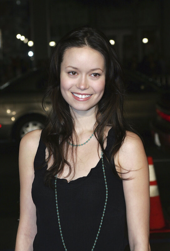 woman in black top smiling