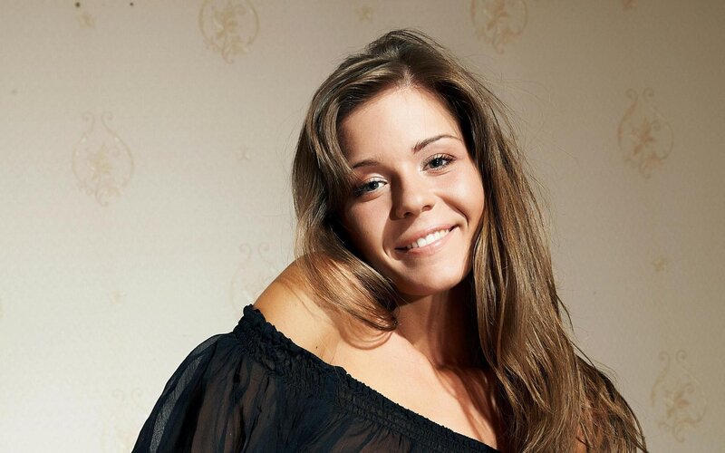 woman in black top smiling