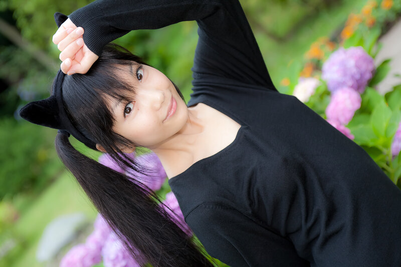 Woman in black top with cat ears