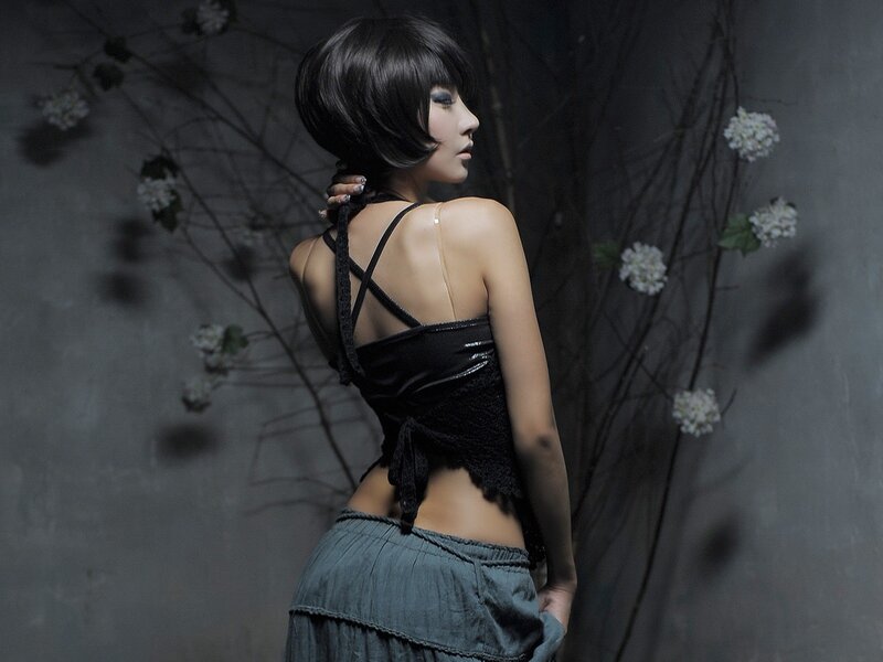 woman in black top with flowers