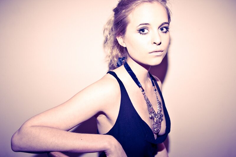 woman in black top with necklace