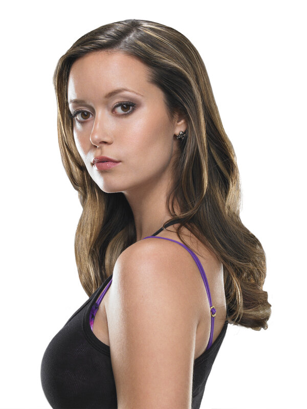 woman in black top with purple straps