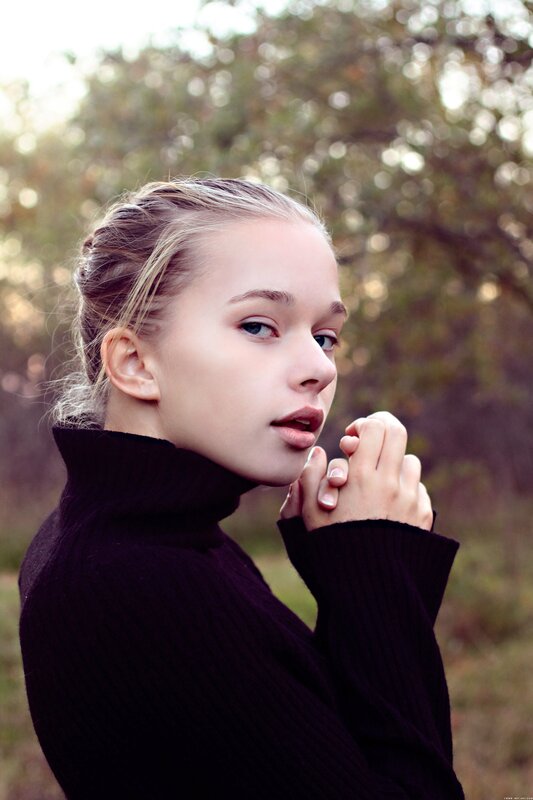 woman in black turtleneck