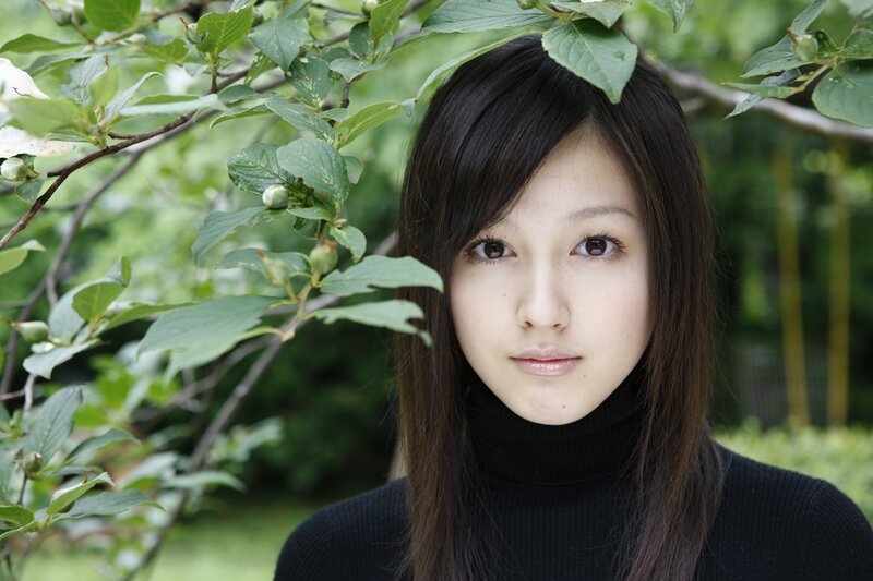 woman in black turtleneck