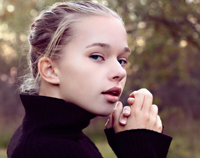 woman in black turtleneck