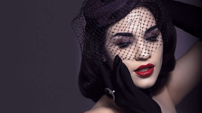 woman in black veil and gloves