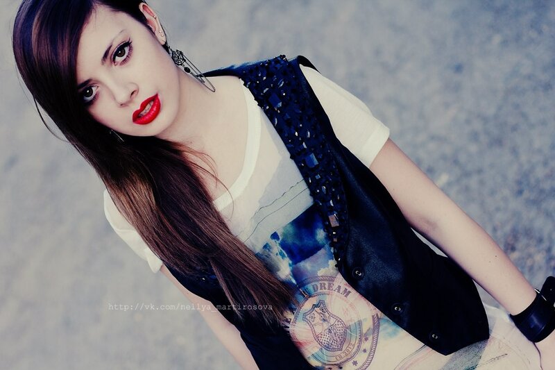 woman in black vest