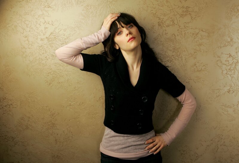 woman in black vest posing