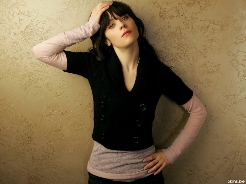 woman in black vest posing