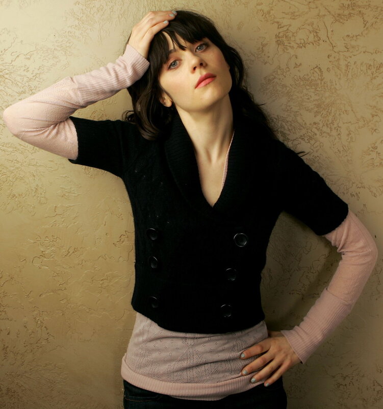 woman in black vest posing
