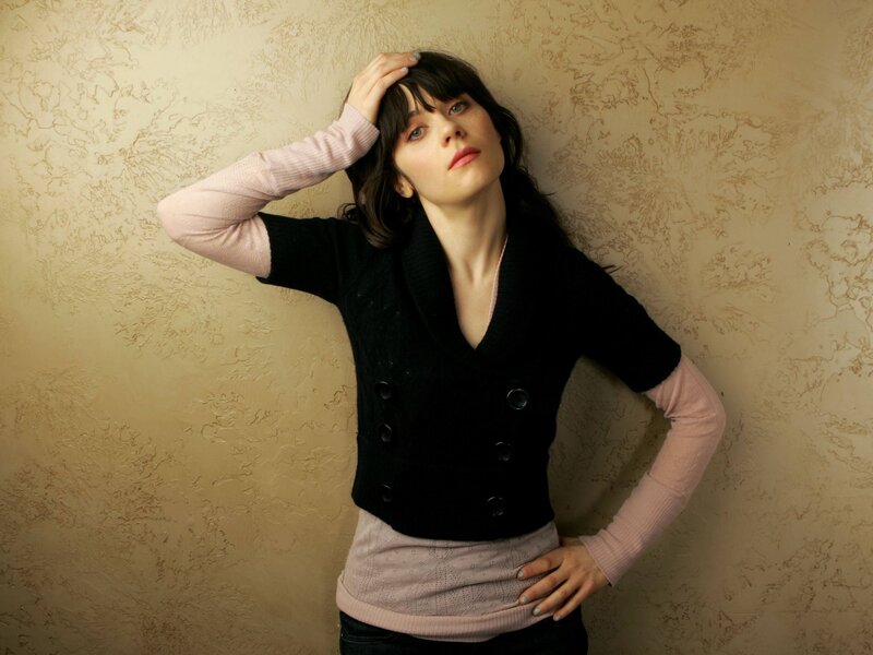 woman in black vest posing