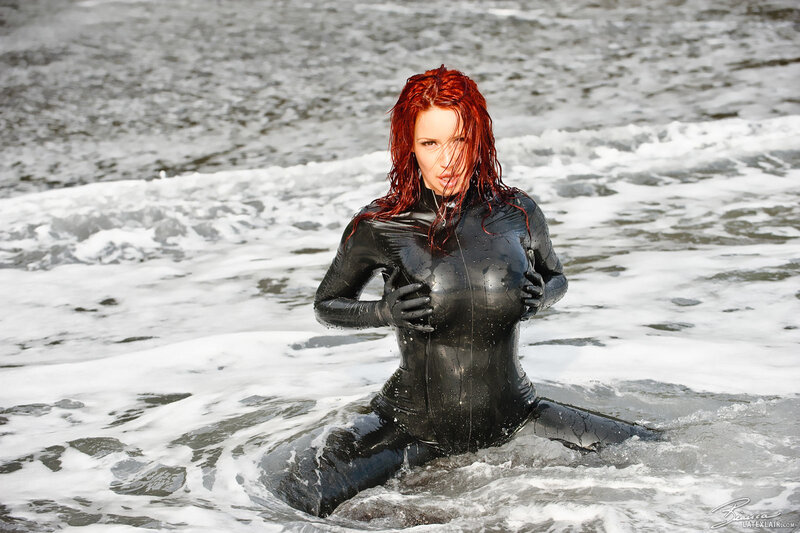 woman in black wetsuit at beach