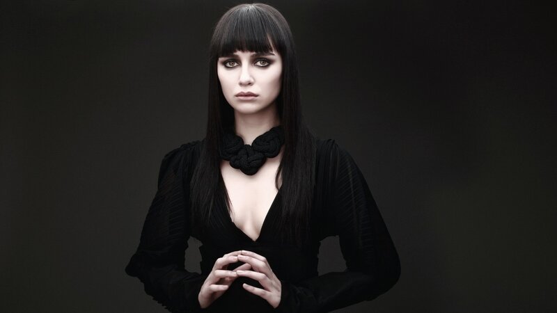 woman in black with bold makeup