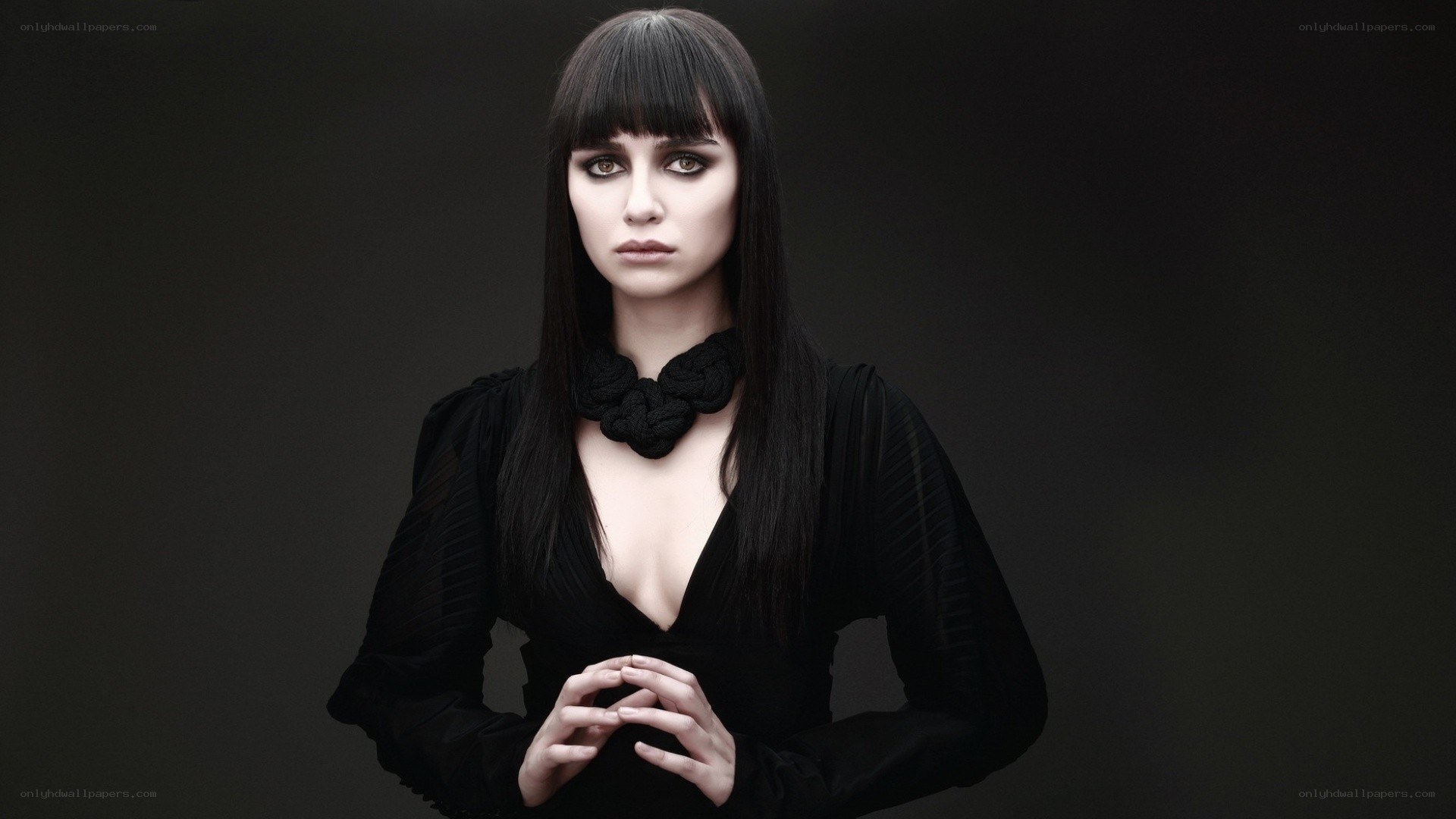 woman in black with bold makeup