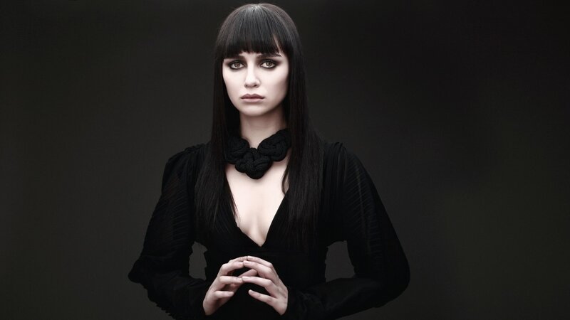 woman in black with dark makeup