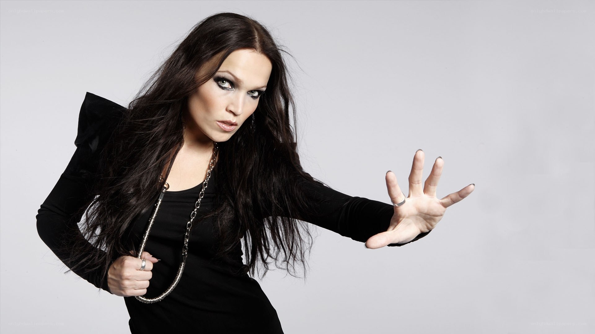woman in black with dramatic pose