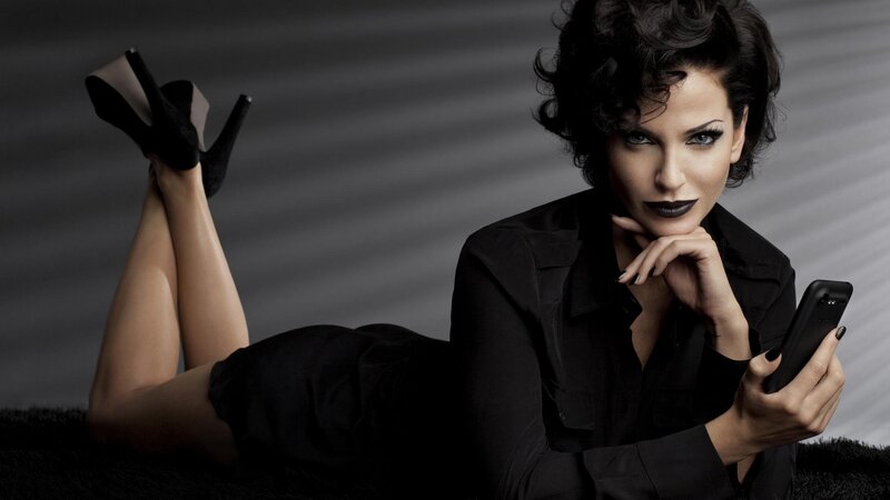 woman in black with smartphone