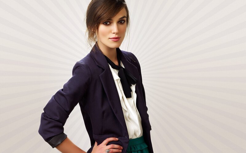 woman in blazer and bow tie