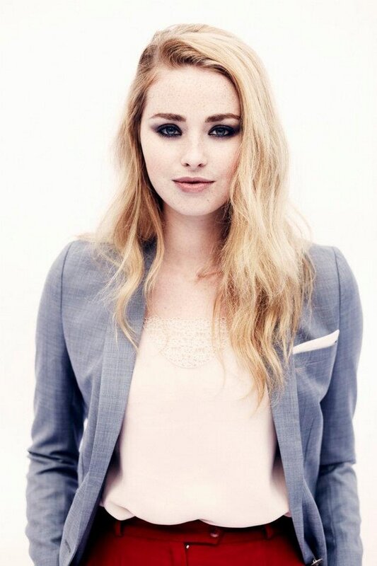 woman in blazer and red pants
