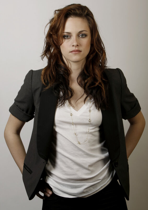 woman in blazer and white top