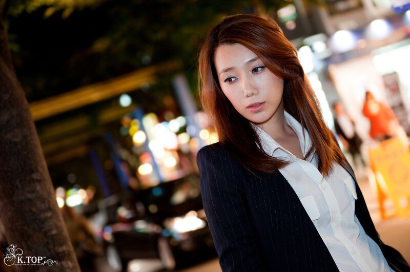 woman in blazer at night