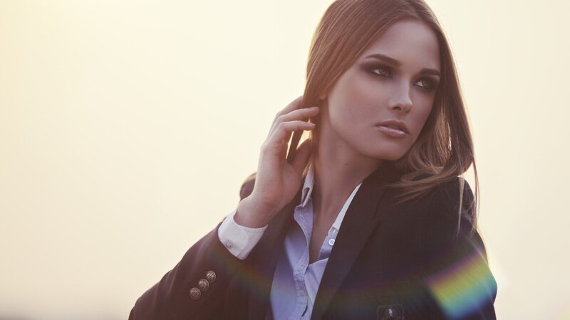 woman in blazer at sunset