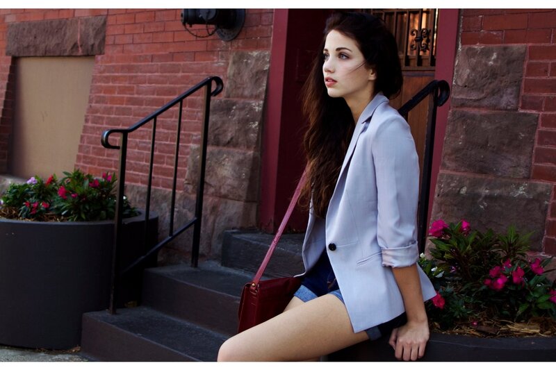 Woman in blazer on steps