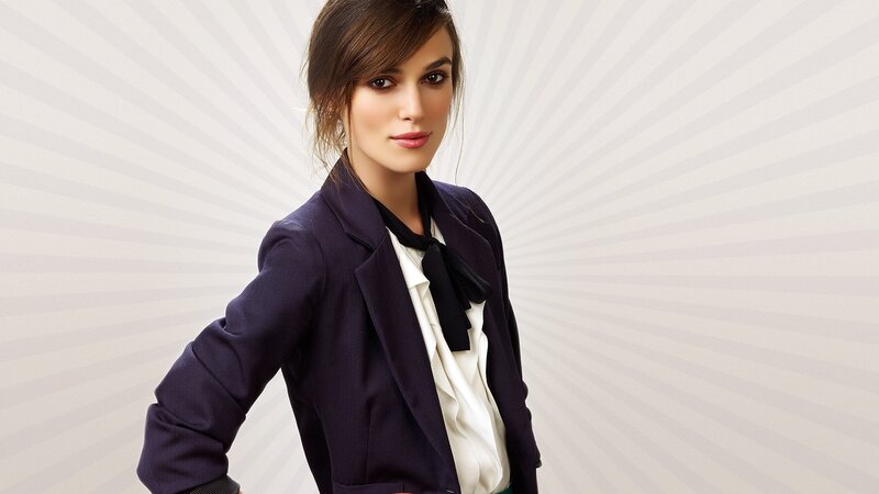 woman in blazer with bow tie
