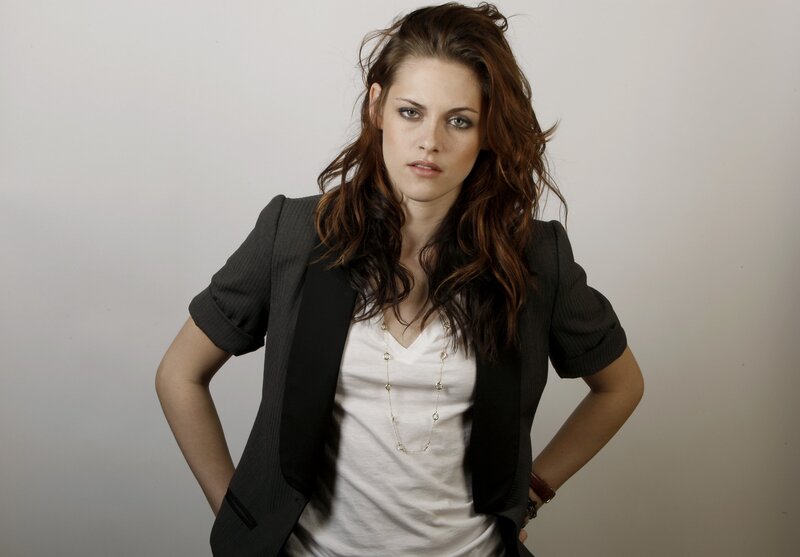 woman in blazer with hands on hips