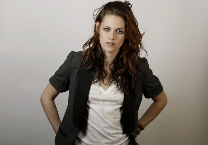 woman in blazer with hands on hips