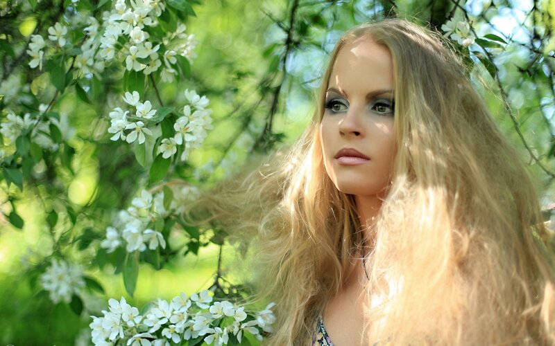 woman in blooming garden