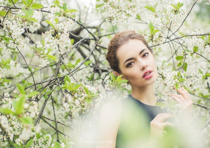 Woman in Blossoming Tree