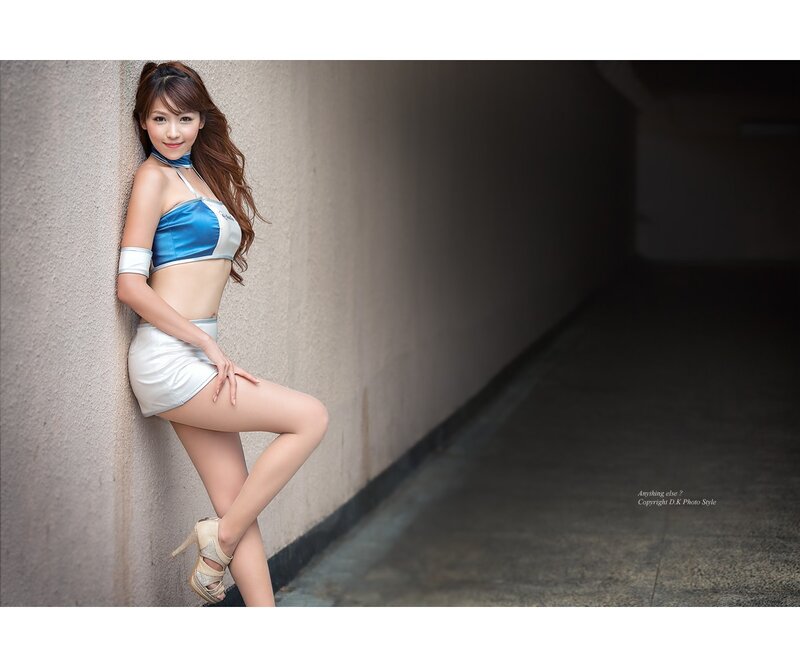 Woman in Blue and White Outfit — Dramatic