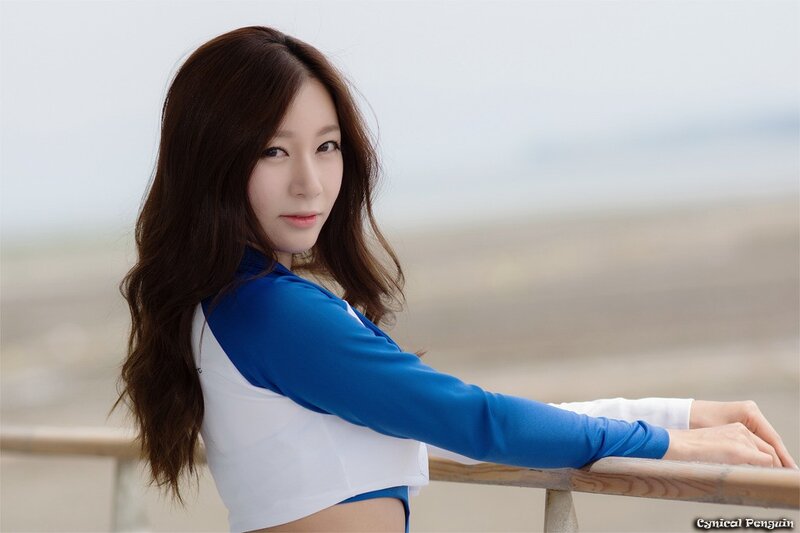 woman in blue and white top