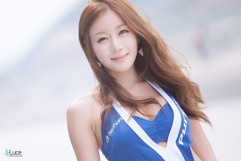 woman in blue and white top