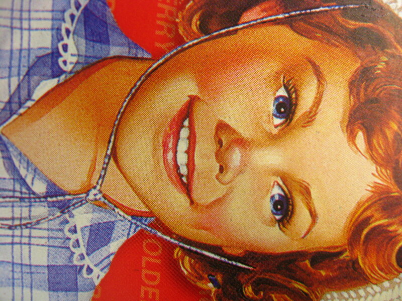 woman in blue apron smiling