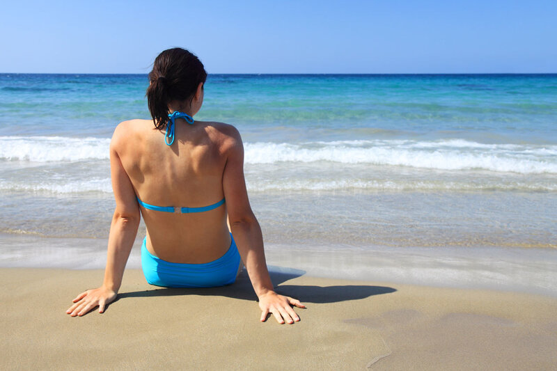 Woman in blue bikini at beach