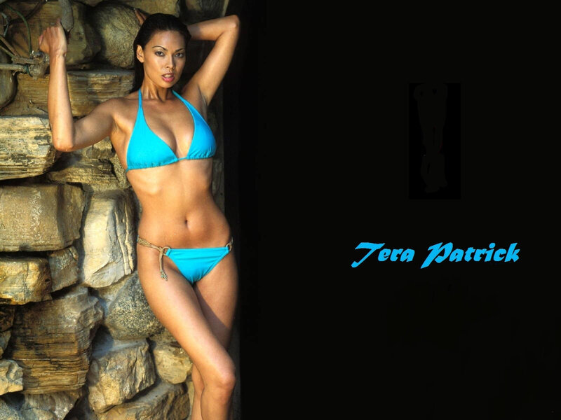 Woman in Blue Bikini — Confident, Afternoon, Photograph, Stone Wall