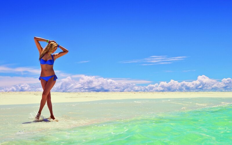 Woman in blue bikini on beach
