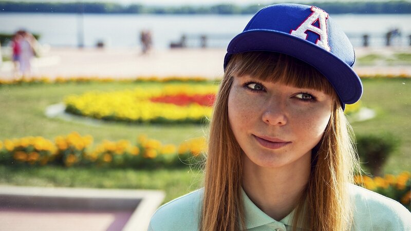 woman in blue cap at park